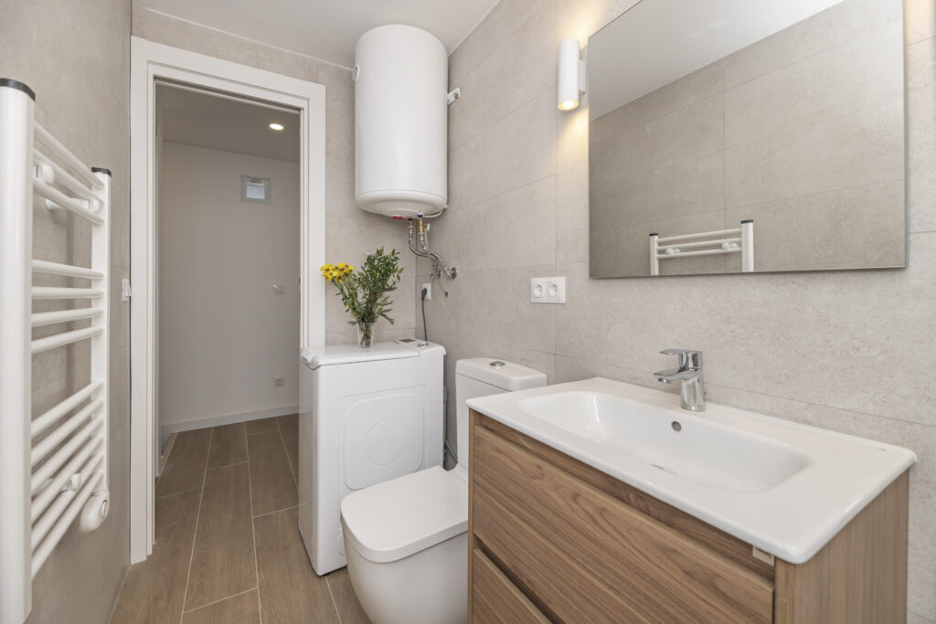 Wall-Hung Vanities in Philadelphia Rowhome Bathrooms shown in a realistic Philadelphia, PA residential construction setting.