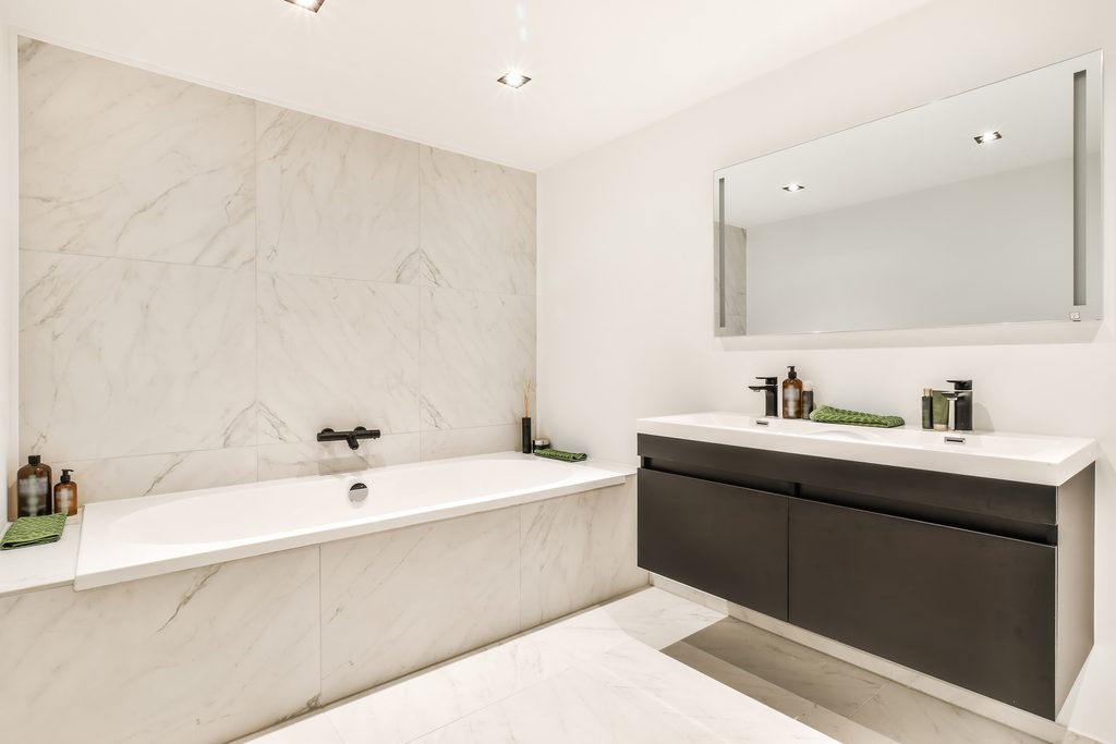 Wall-Hung Vanities in Philadelphia Rowhome Bathrooms shown in a realistic Philadelphia, PA residential construction setting.