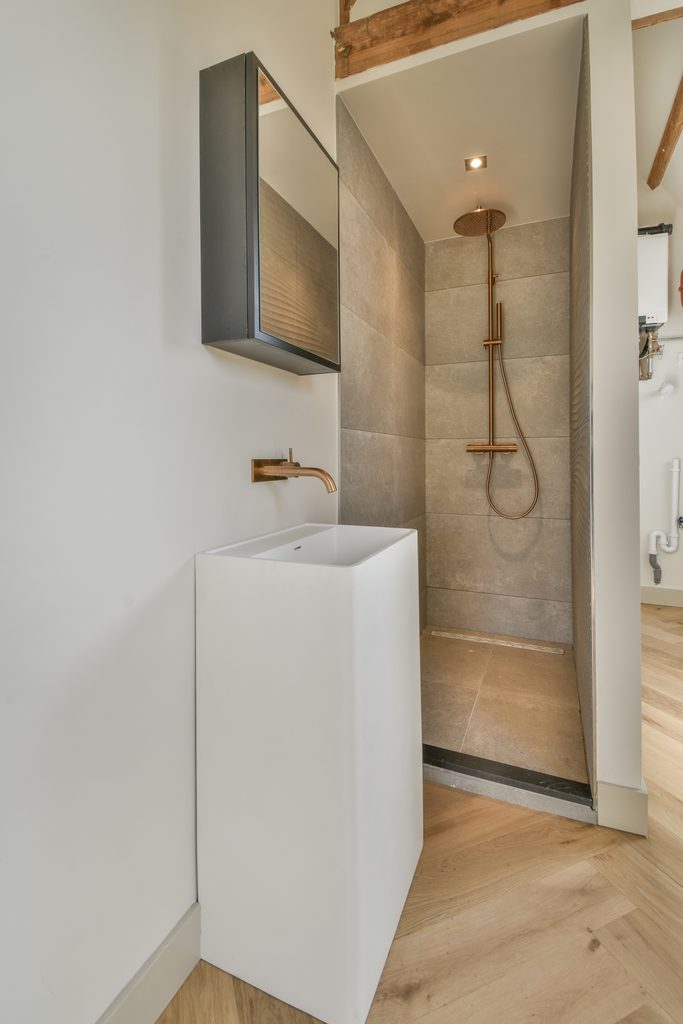 Wall-Hung Vanities in Philadelphia Rowhome Bathrooms shown in a realistic Philadelphia, PA residential construction setting.